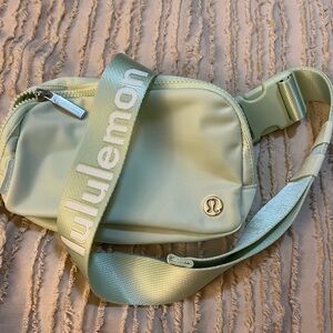 Authey Lululemon Everywhere belt bag , with logo word mark on strap . Mint color